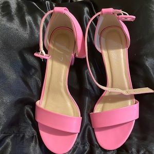 Barbie pink slightly worn chunky open toe heel.